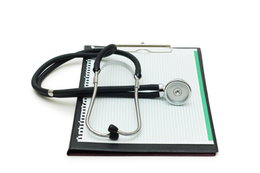 Skriveblokk og stetoskop