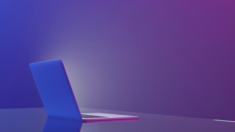 En mac på et bord. Foto: Akademikerne pluss