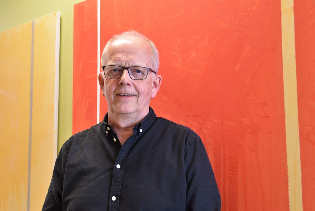 Older man with colorful background